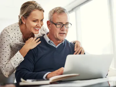 Retirement planning illustrated with couple reviewing financial plan